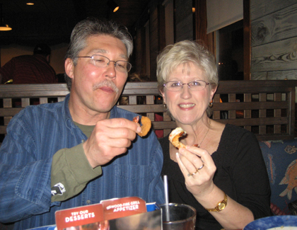 Bob and Mom doing a shrimp toast to commemorate her 59th year